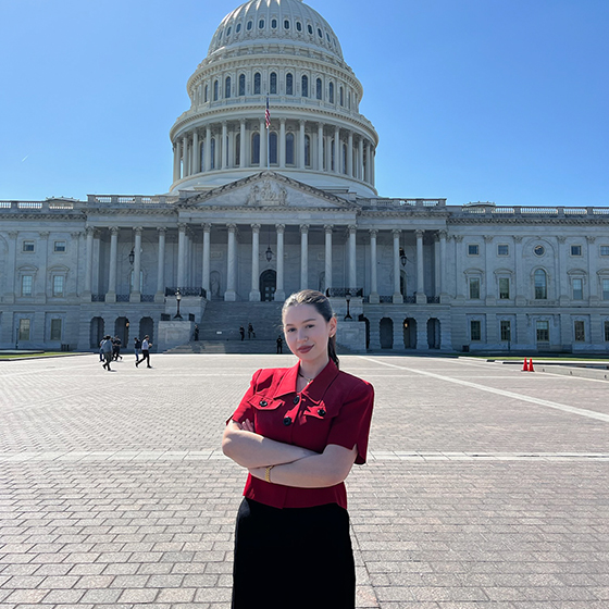 Mikah Bein stands in front of the US Capitol