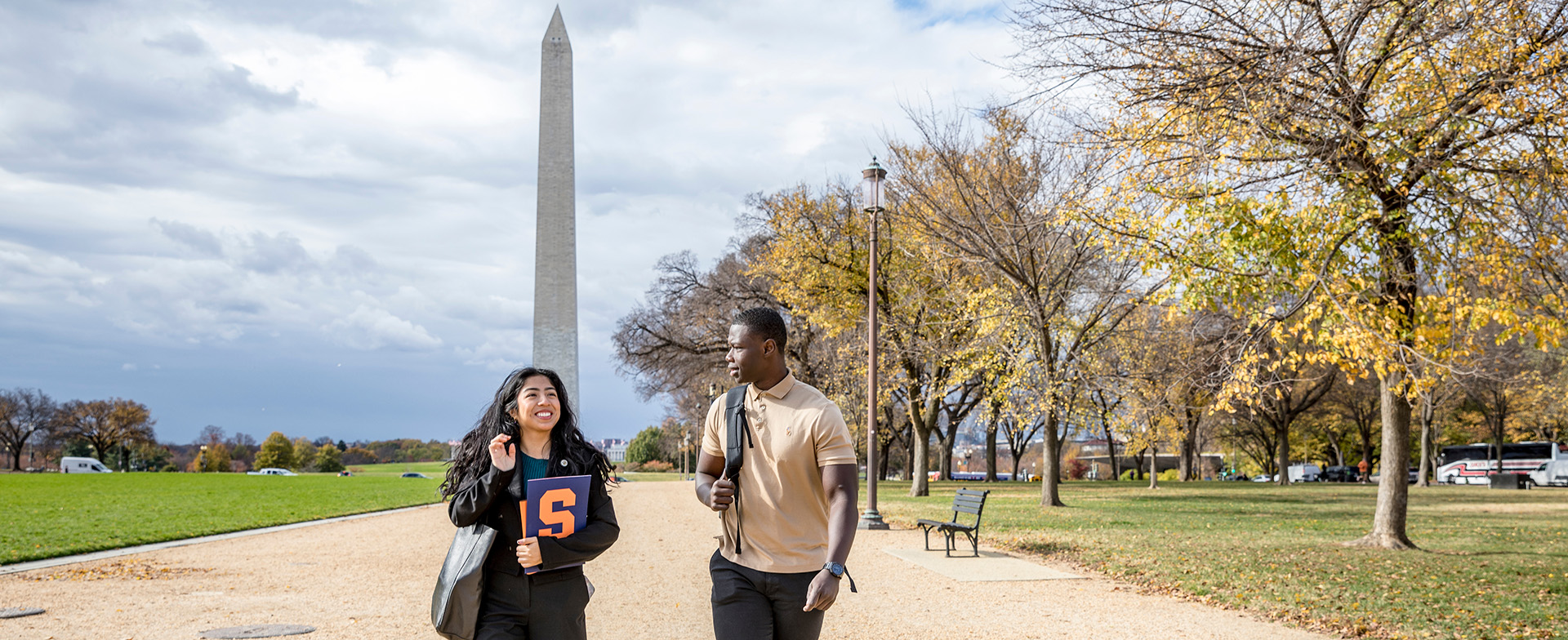 Two Maxwell-in-DC students in front of the Washington Monument