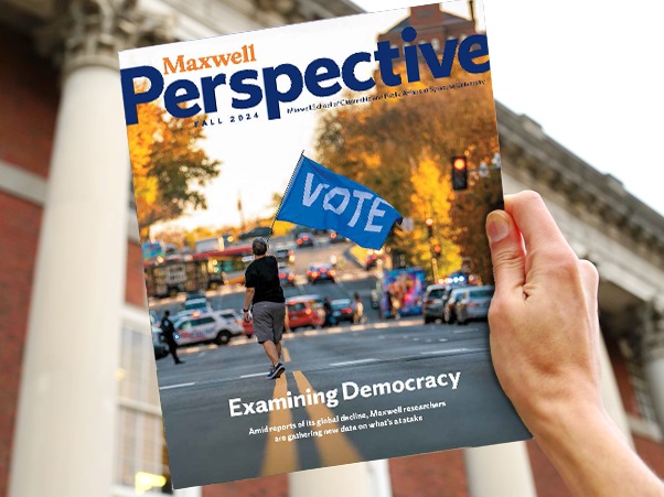 A person holding the fall 2024 issue of Perspective magazine.